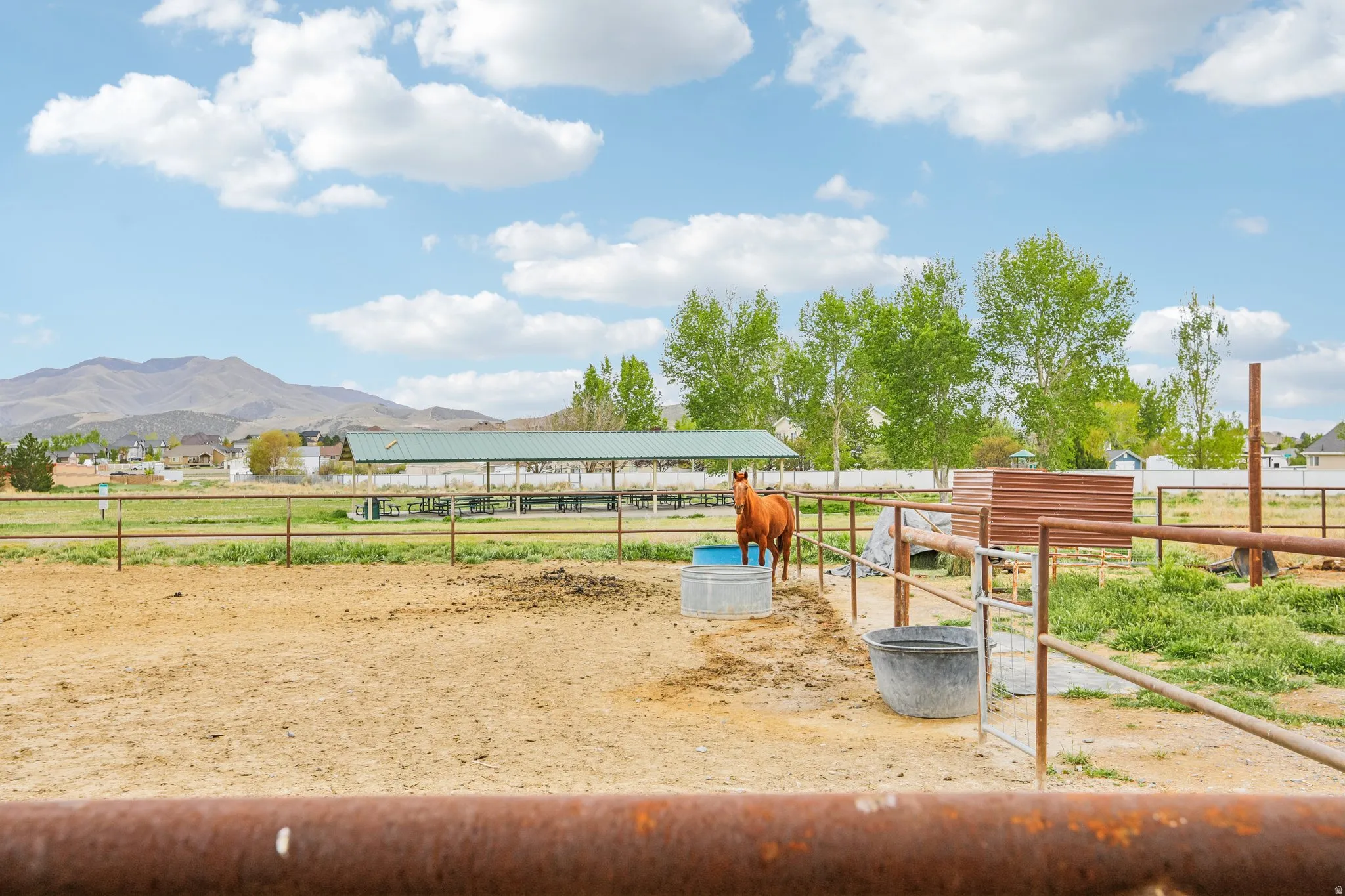 View of home's community with an outdoor structure, an exterior structure, and a mountain view