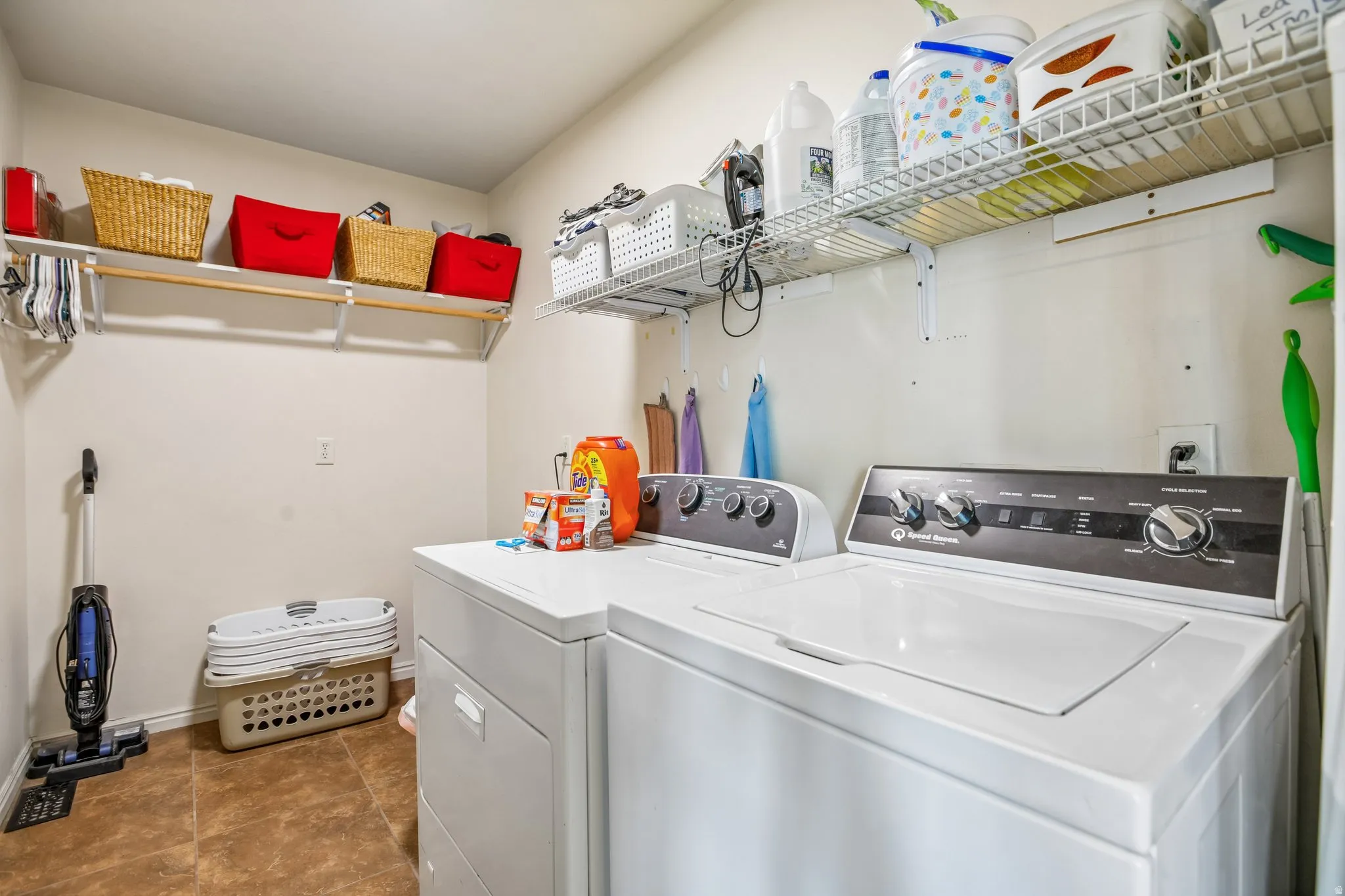 Laundry area with washer and clothes dryer