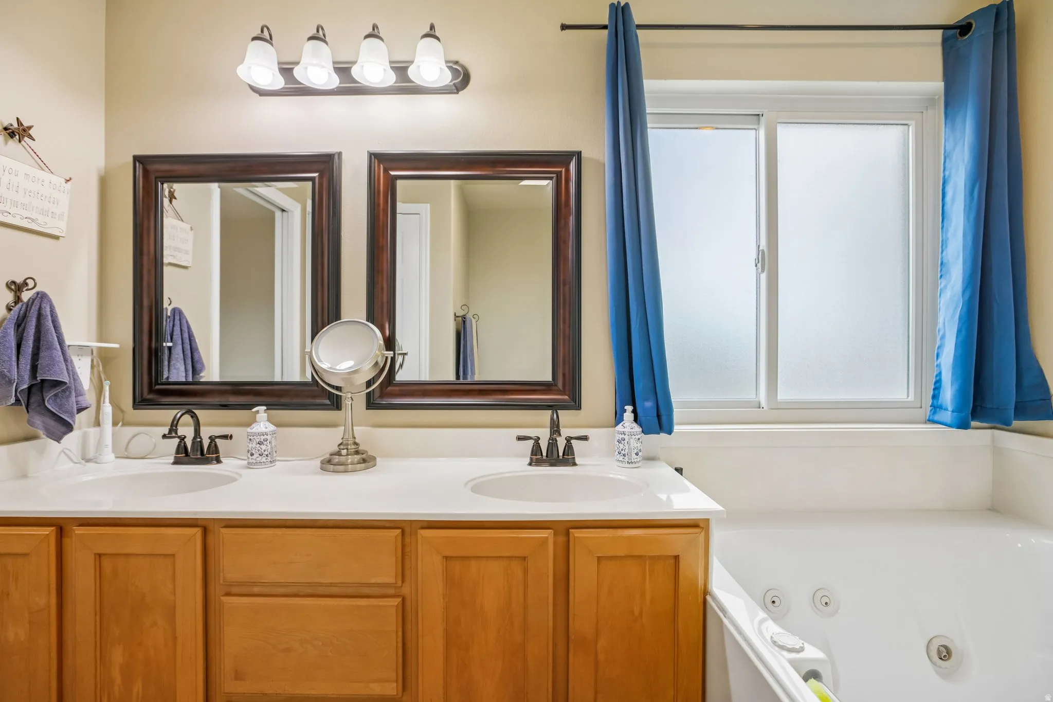 Primary bathroom. Full bathroom featuring double vanity and a jetted tub