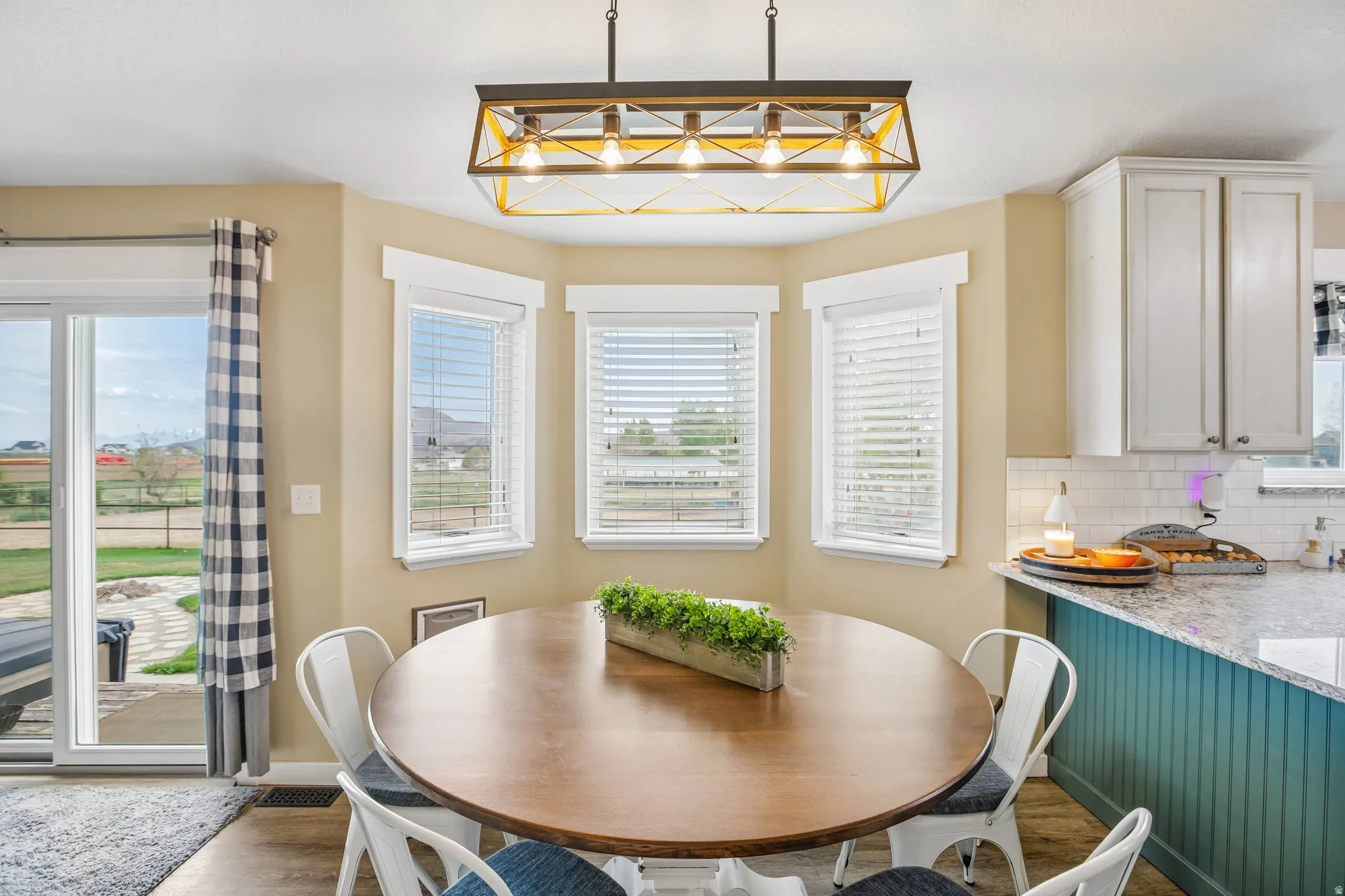 Dining space with baseboards and wood finished floors