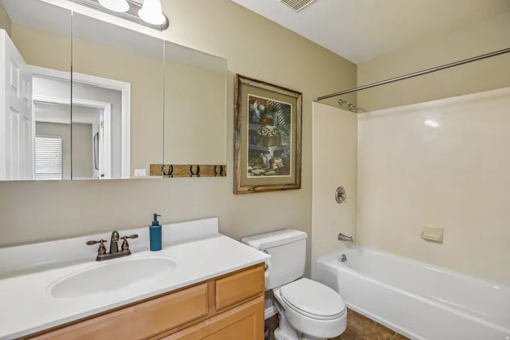 Full bath featuring vanity and shower / bathtub combination
