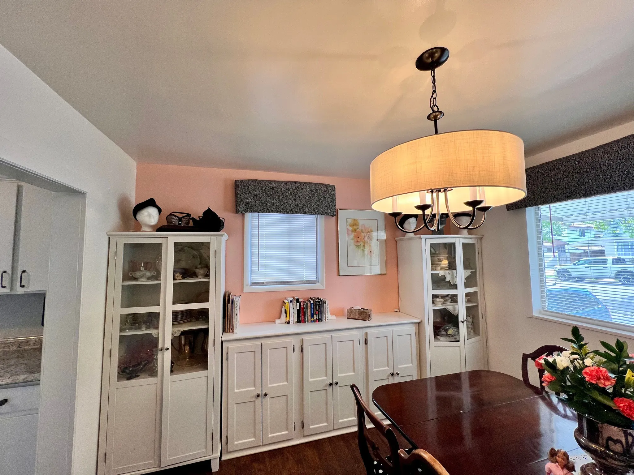 Dining space with dark wood-style flooring