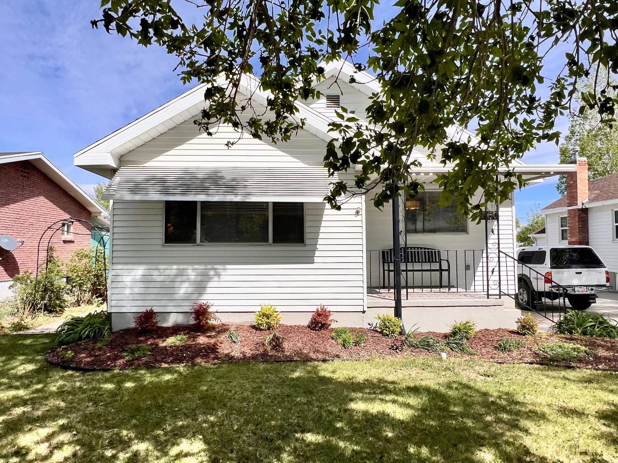 View of front of home featuring a front yard and a porch