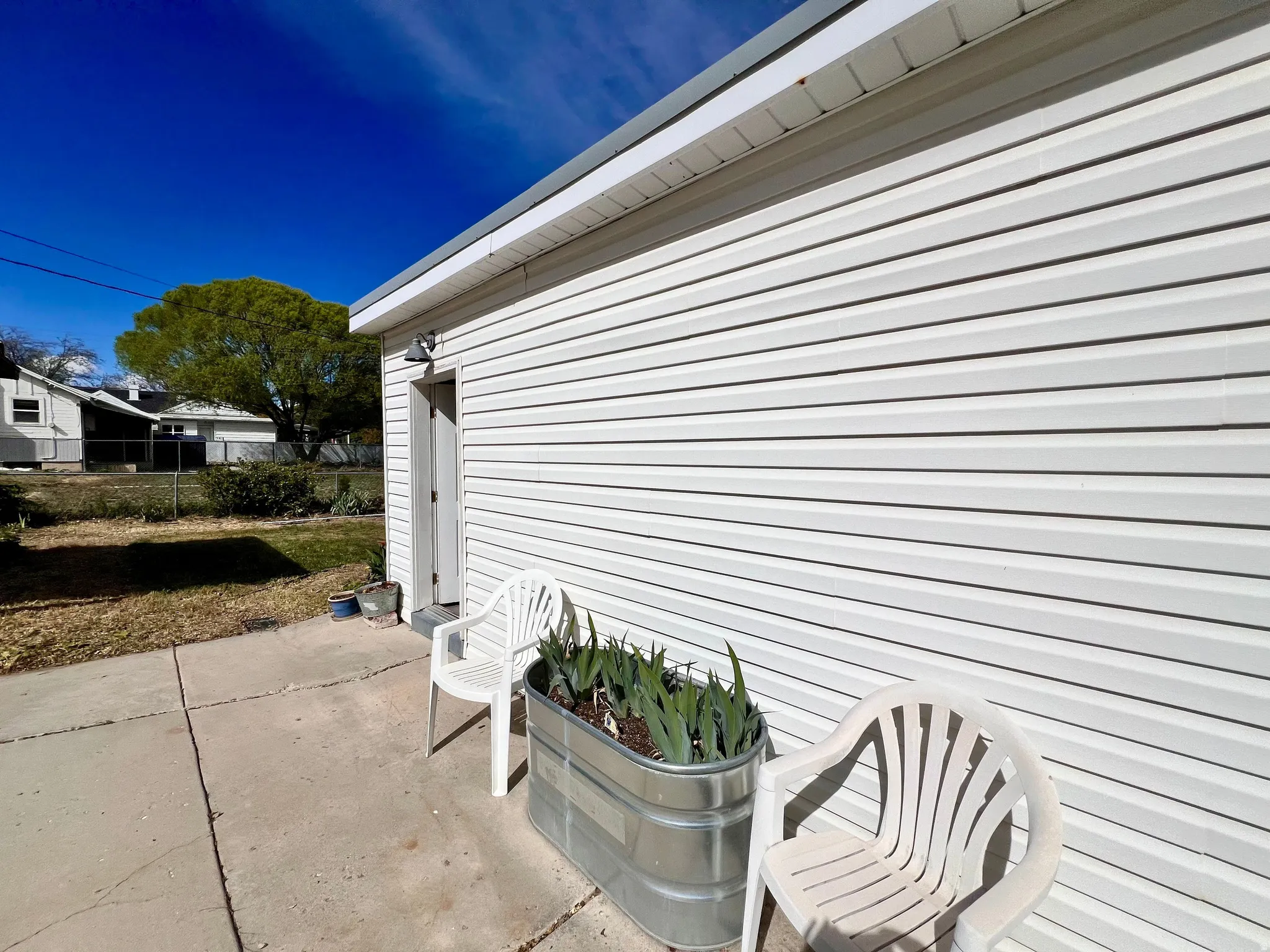 View of exterior of detached studio/shop.