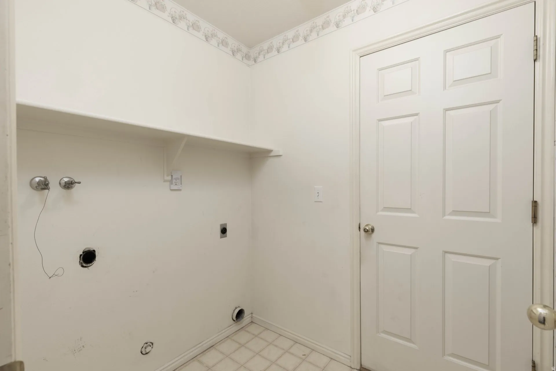 Laundry area featuring light flooring, hookup for an electric dryer, and washer hookup