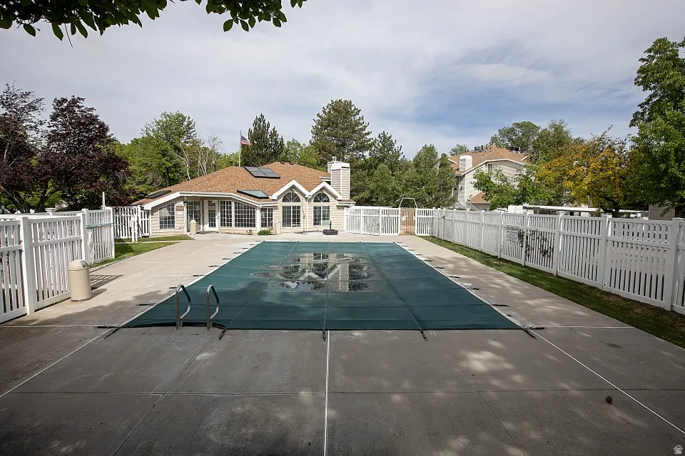 View of swimming pool with a fenced backyard