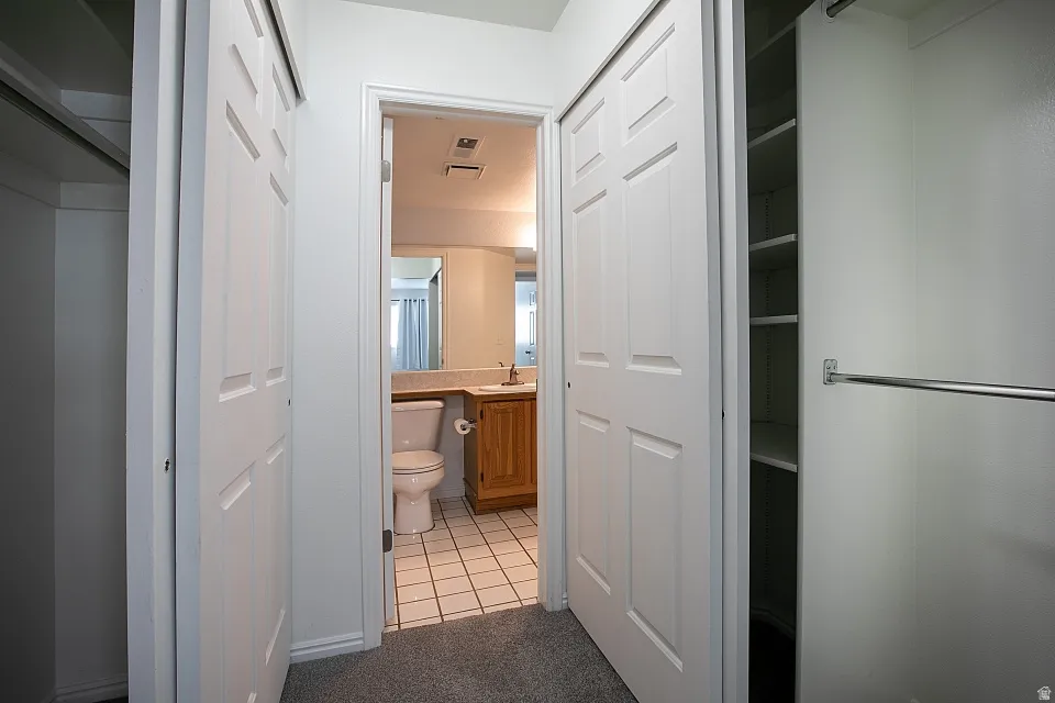 Primary Bedroom closet with separate access to bathroom