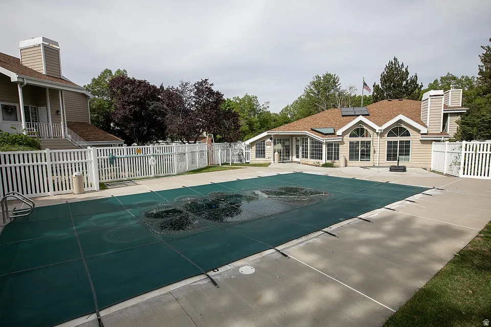 View of pool with a fenced backyard