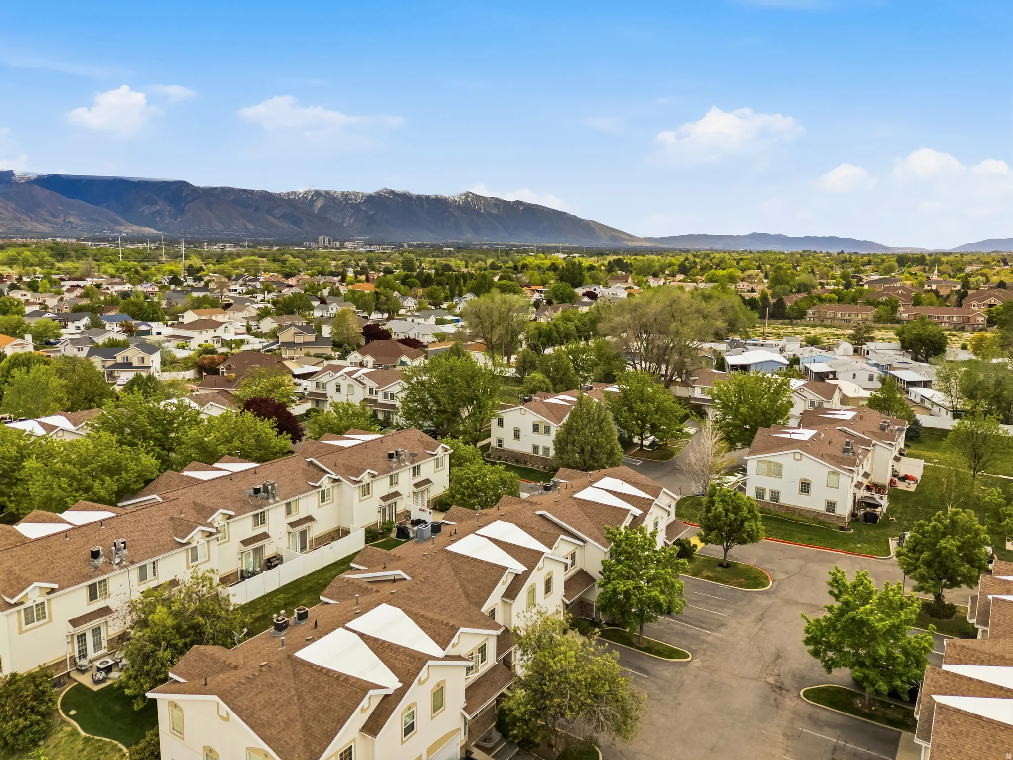 Aerial view of residential area featuring a mountainous background