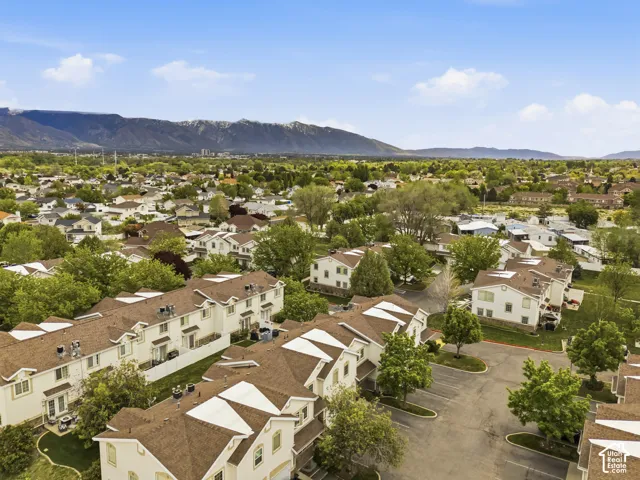 Aerial view of residential area featuring a mountainous background