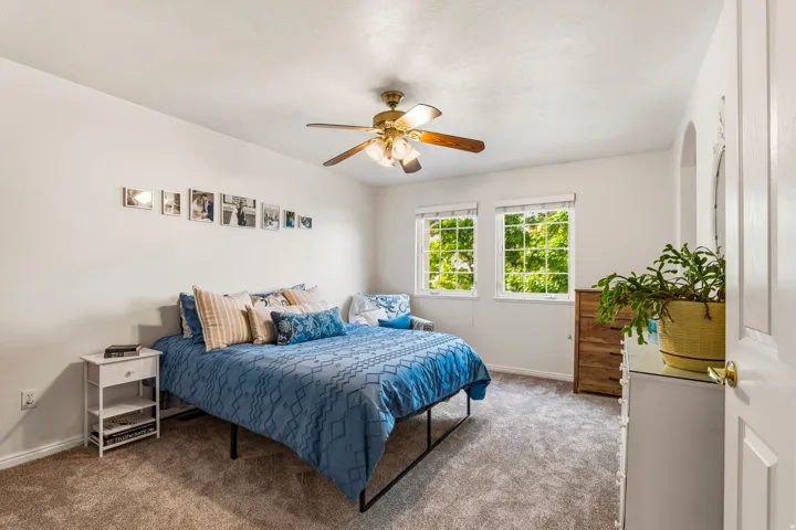 Bedroom featuring carpet floors and ceiling fan