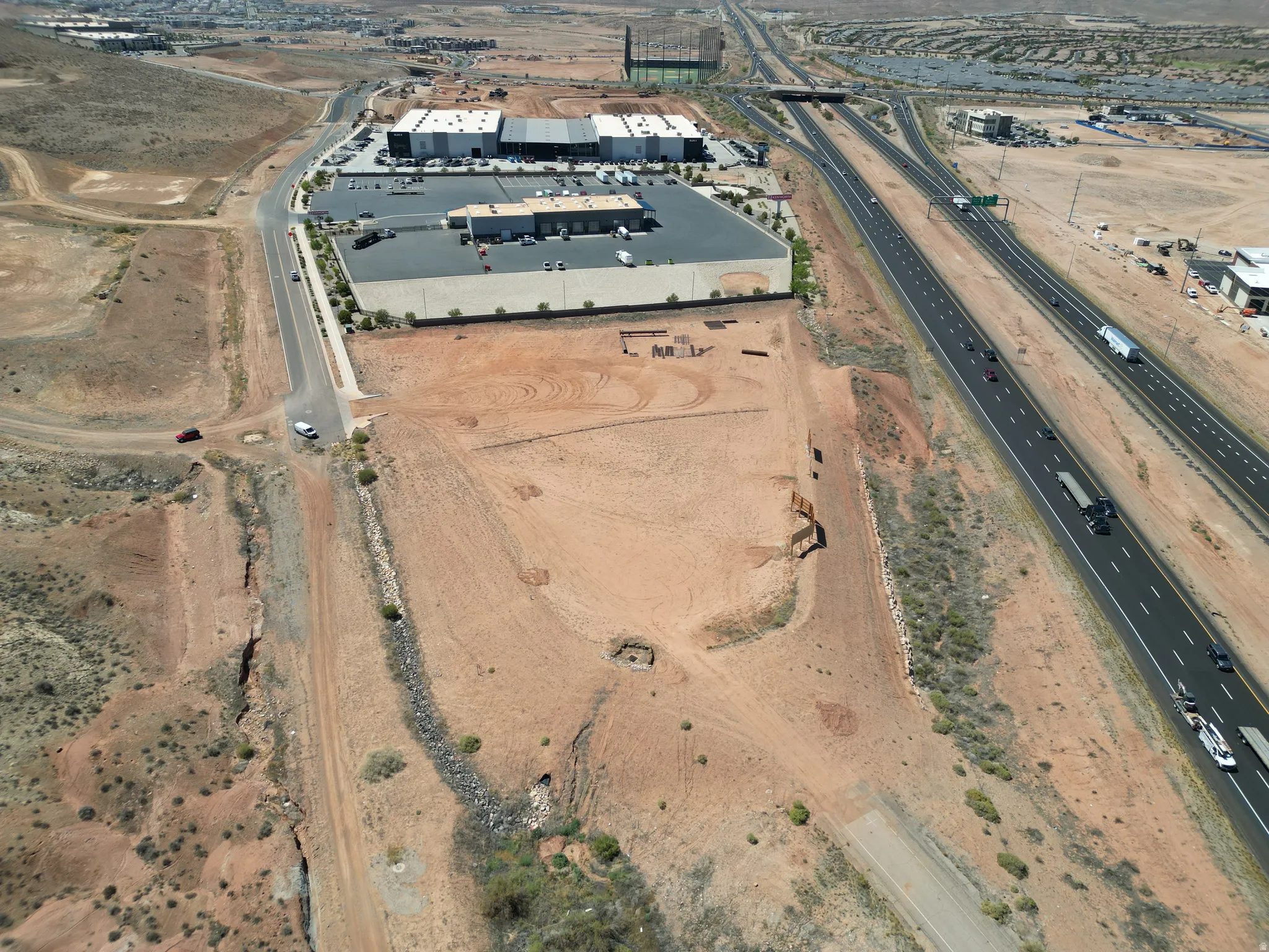 Aerial view of property's location featuring industrial structures