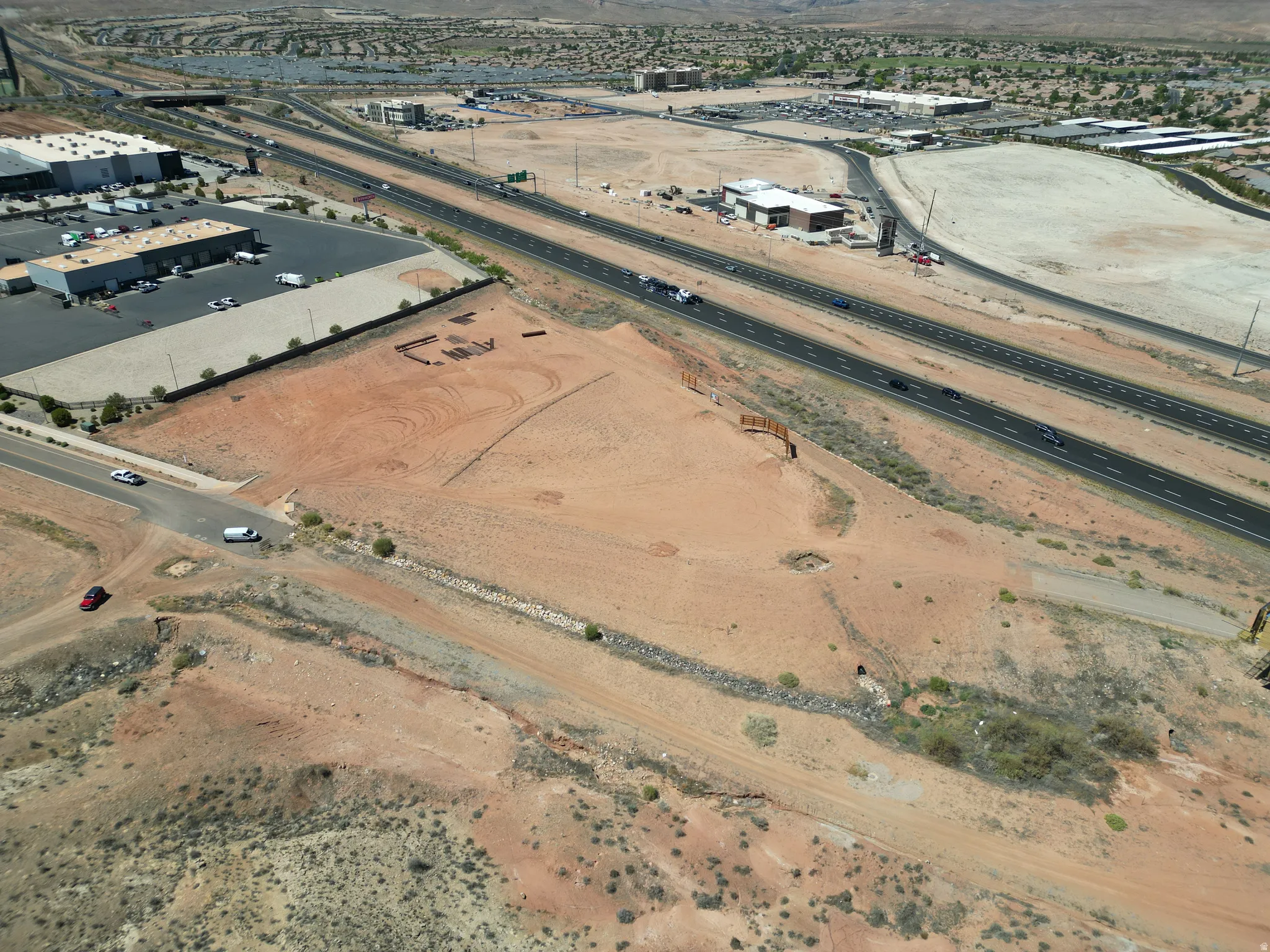 Aerial overview of property's location featuring industrial structures