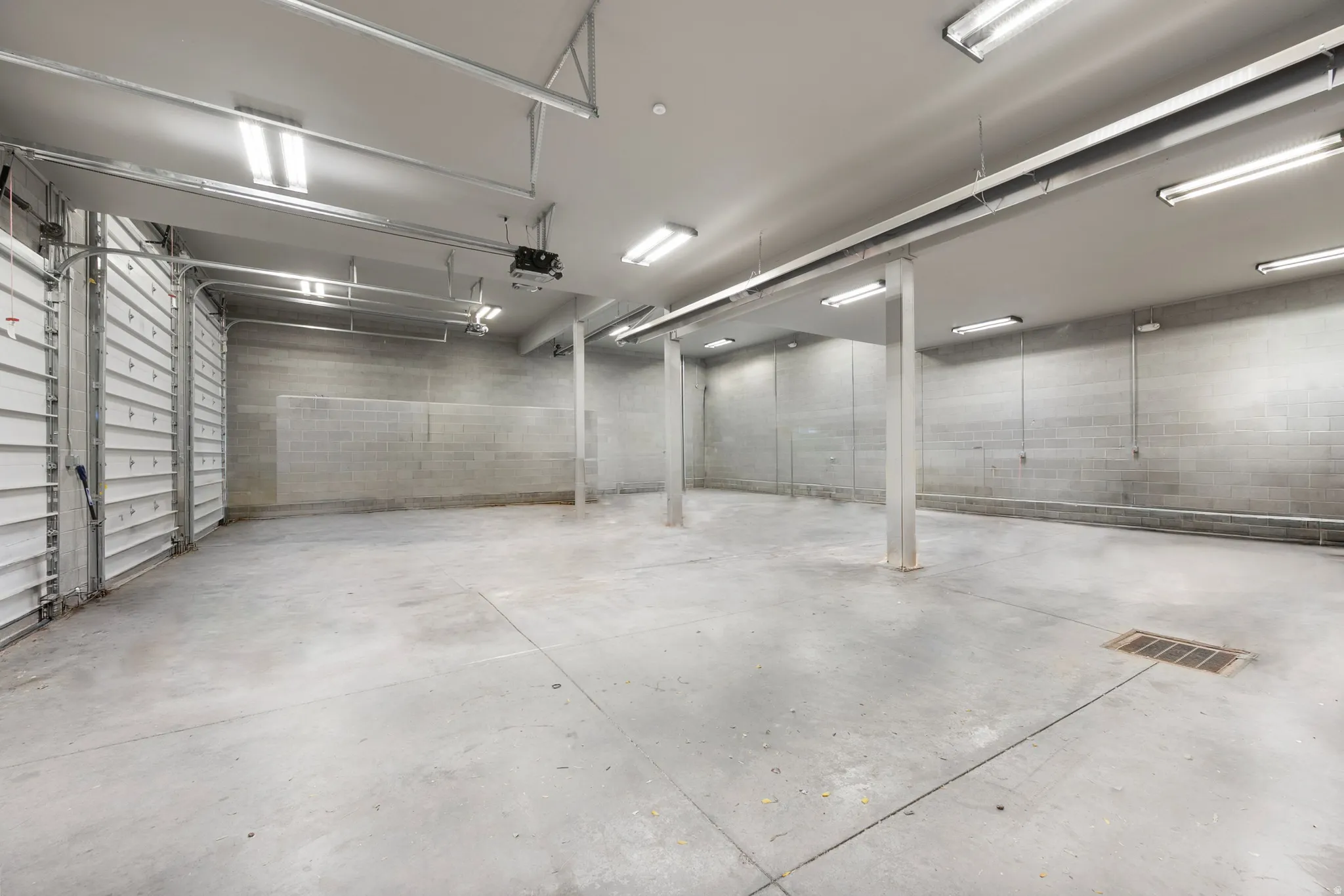 Garage with concrete block wall and a garage door opener