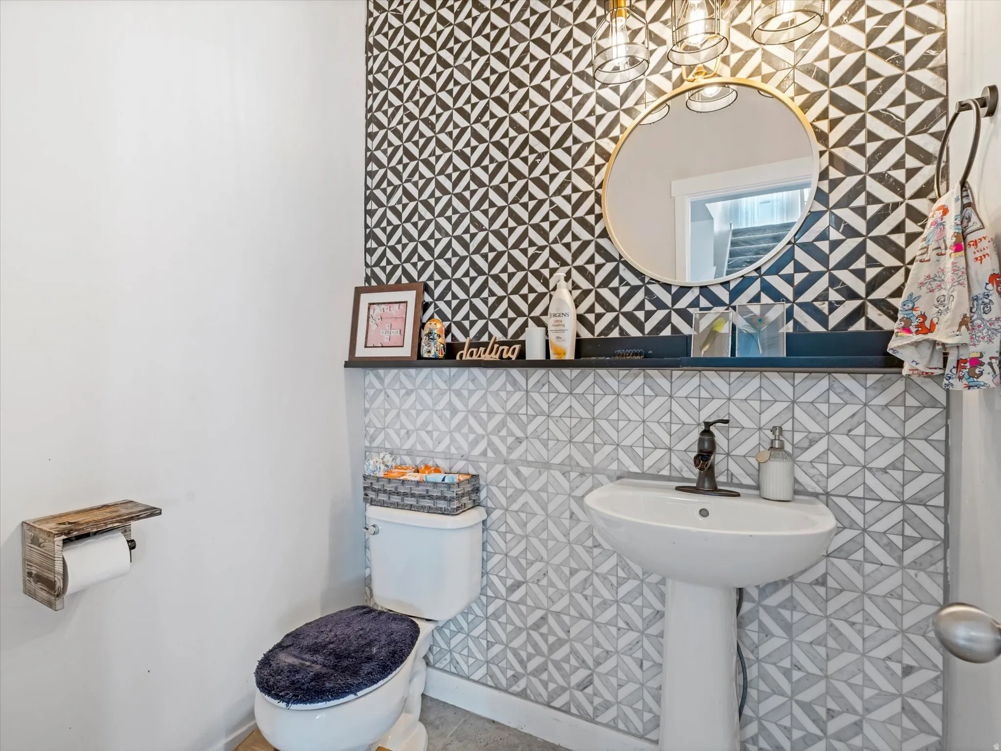 Half bathroom featuring tile walls and tile patterned floors