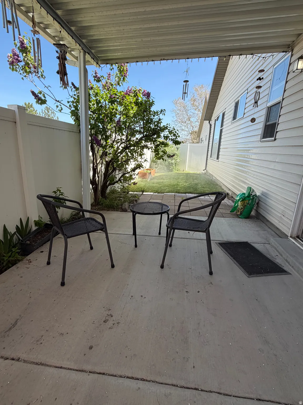 Fenced backyard featuring a patio
