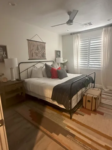 Bedroom featuring a ceiling fan and wood finished floors
