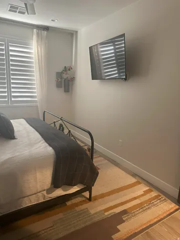 Bedroom featuring baseboards and light wood-style floors