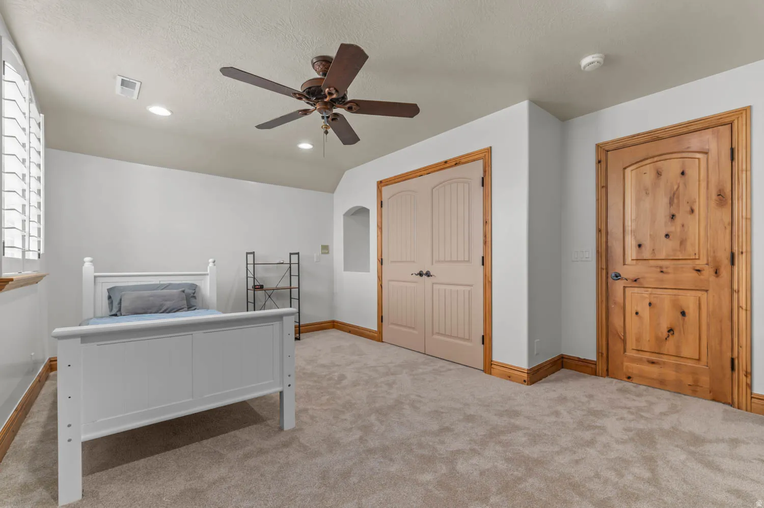Bedroom featuring a closet, a ceiling fan, light colored carpet, and recessed lighting
