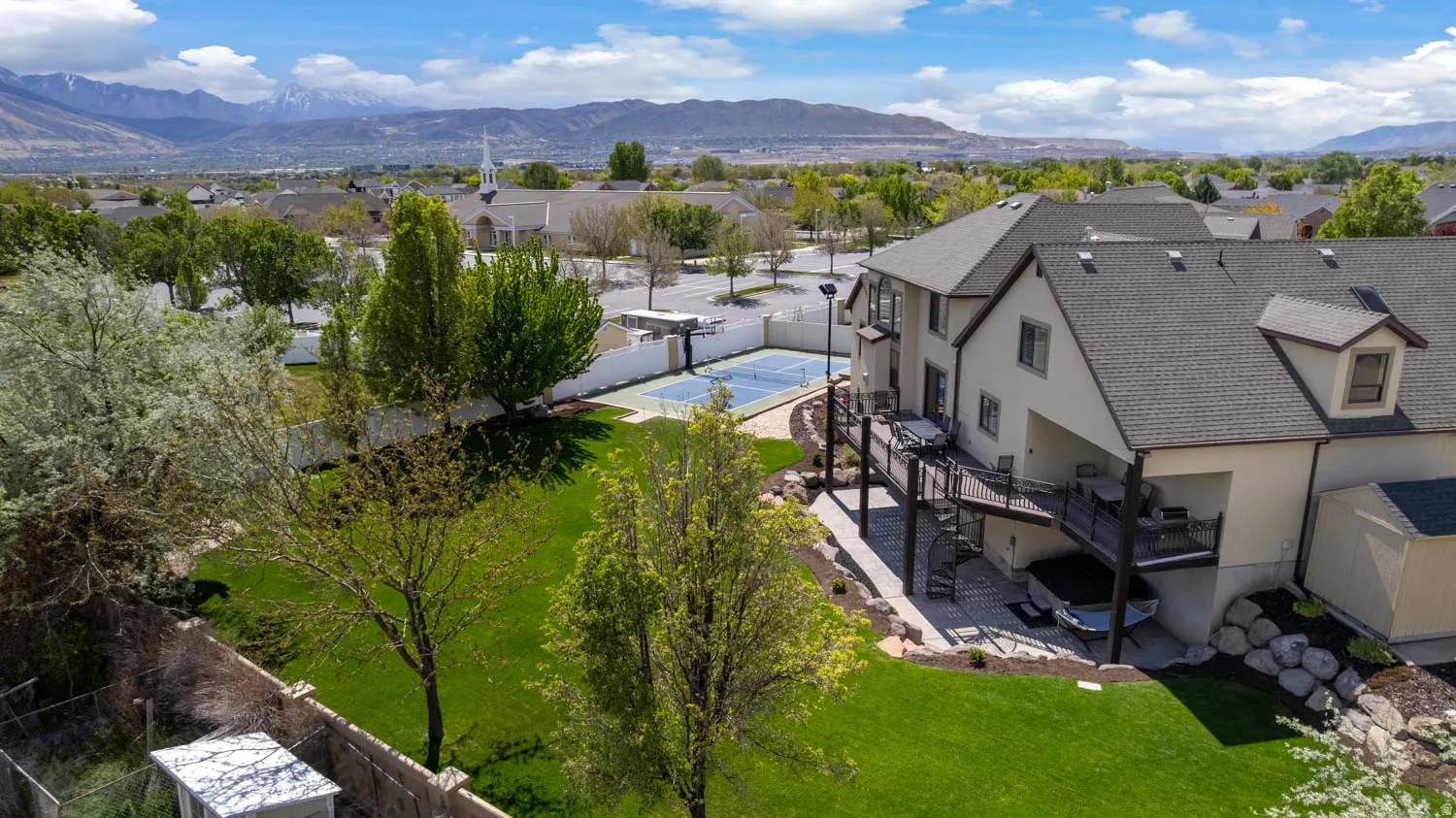 Aerial perspective of suburban area featuring a mountain backdrop