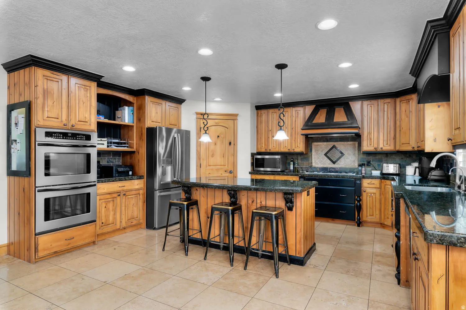 Kitchen featuring open shelves, a kitchen breakfast bar, stainless steel appliances, a kitchen island, and tasteful backsplash