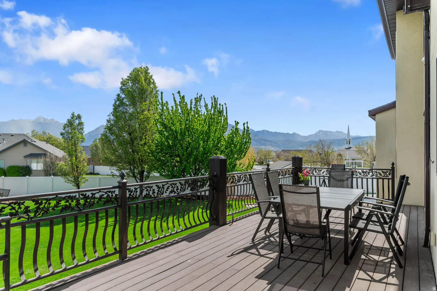 Deck featuring a mountain view and outdoor dining space