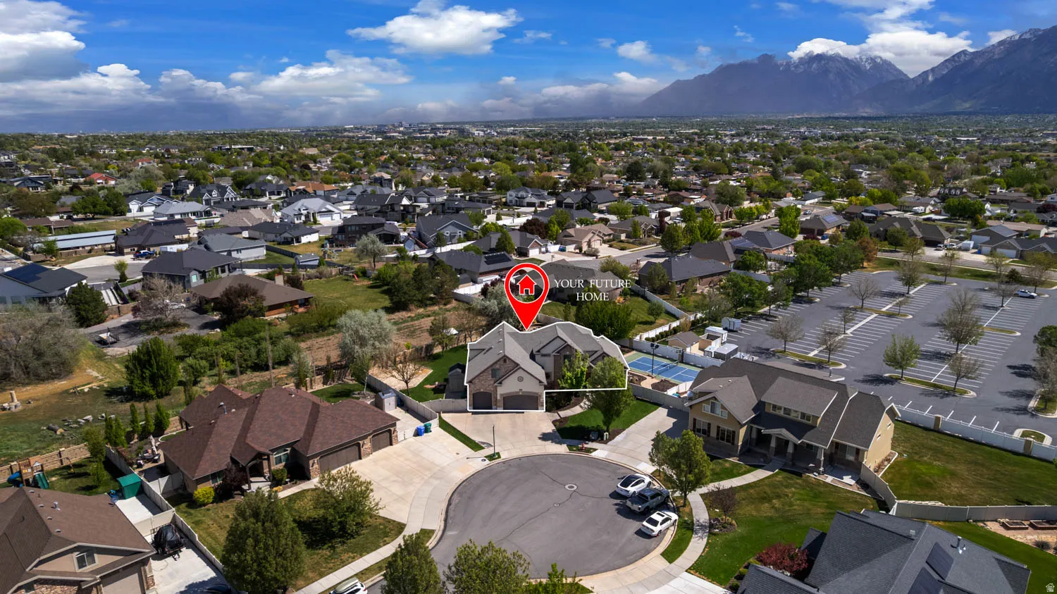 Aerial perspective of suburban area featuring a mountain backdrop