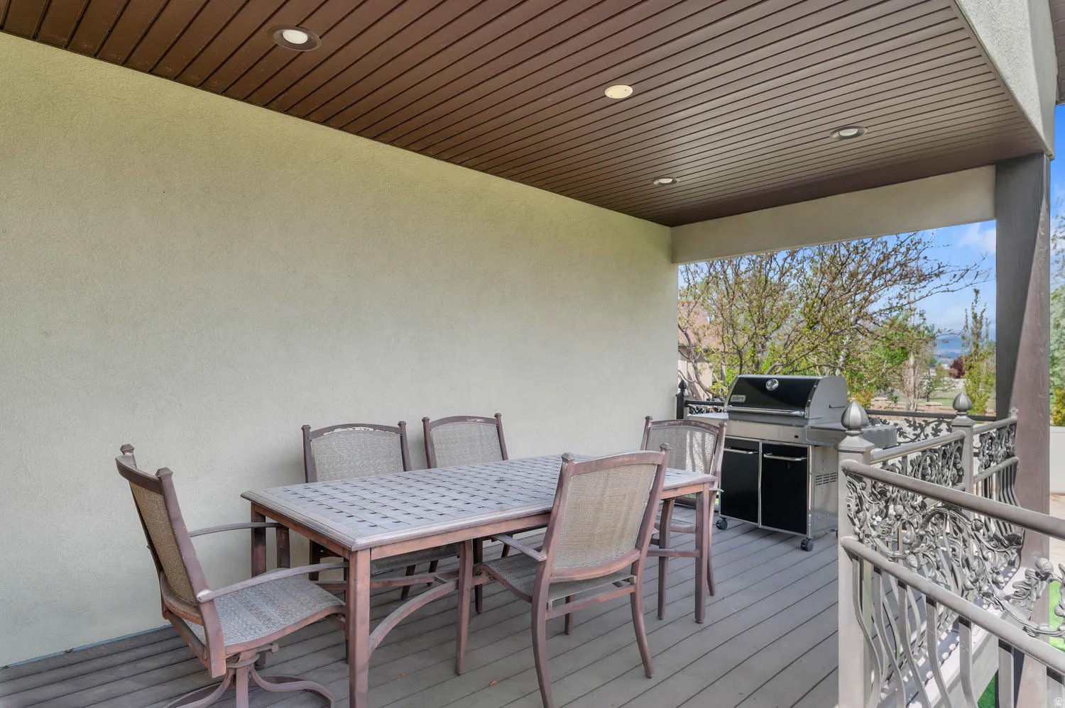 Deck featuring outdoor dining area and grilling area