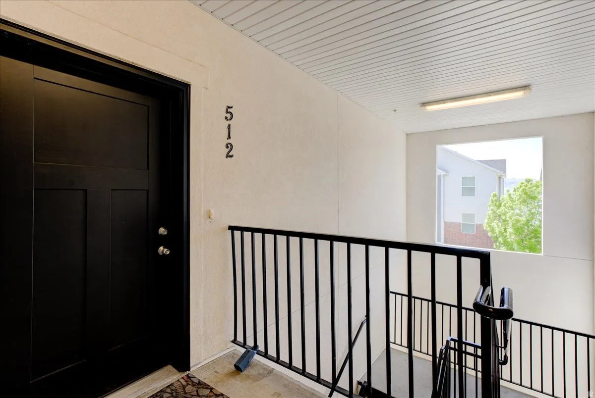 Property entrance with stucco siding