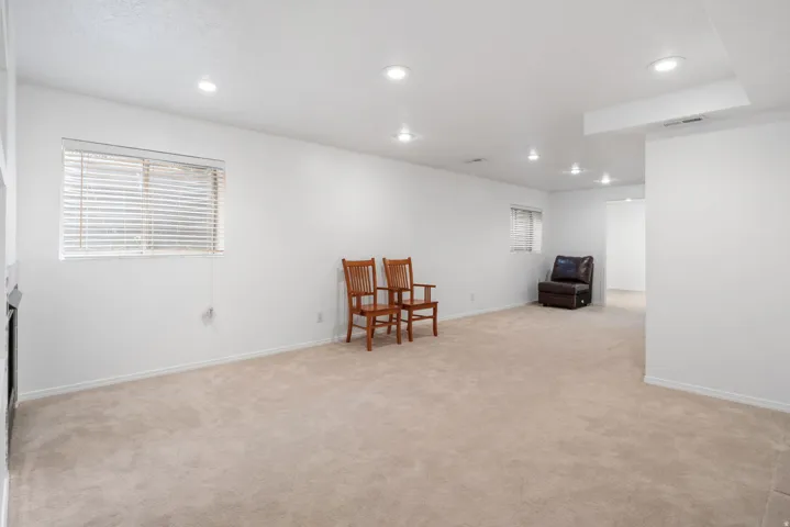 Sitting room featuring light carpet and recessed lighting