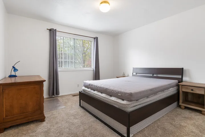 Carpeted bedroom with baseboards