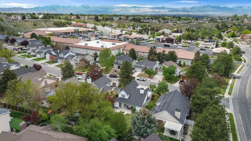 Aerial view of residential area featuring a mountainous background