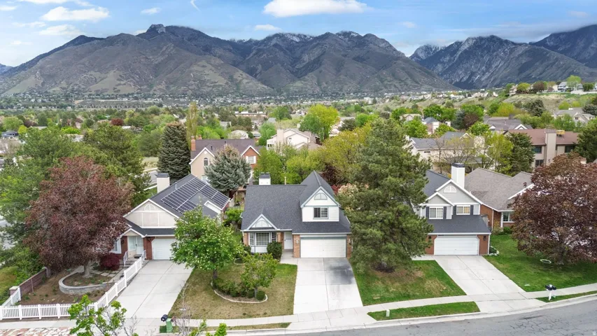 Aerial perspective of suburban area with a mountain backdrop
