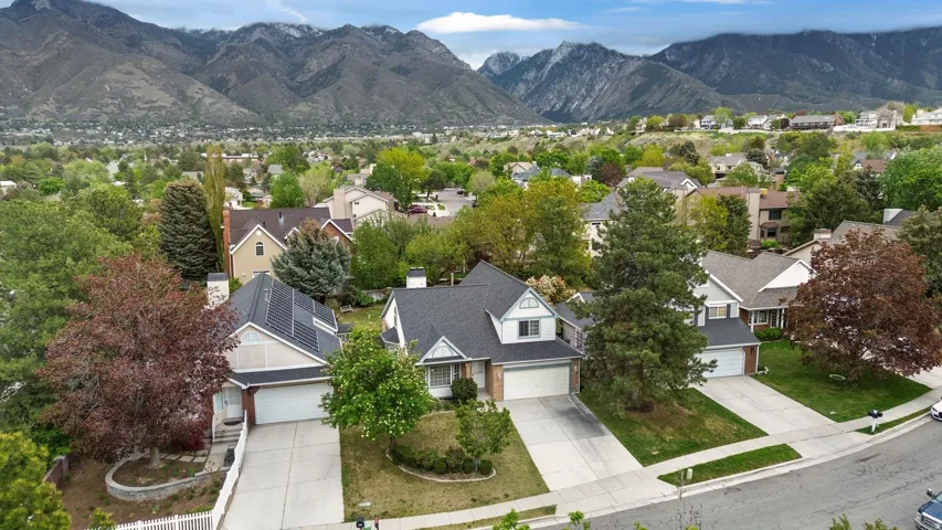 Aerial perspective of suburban area with a mountainous background