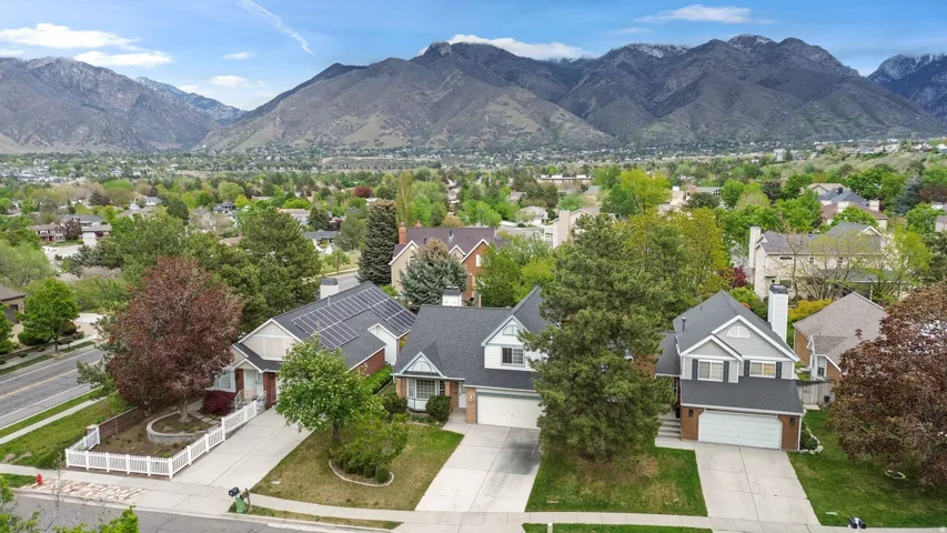 Aerial view of residential area featuring mountains