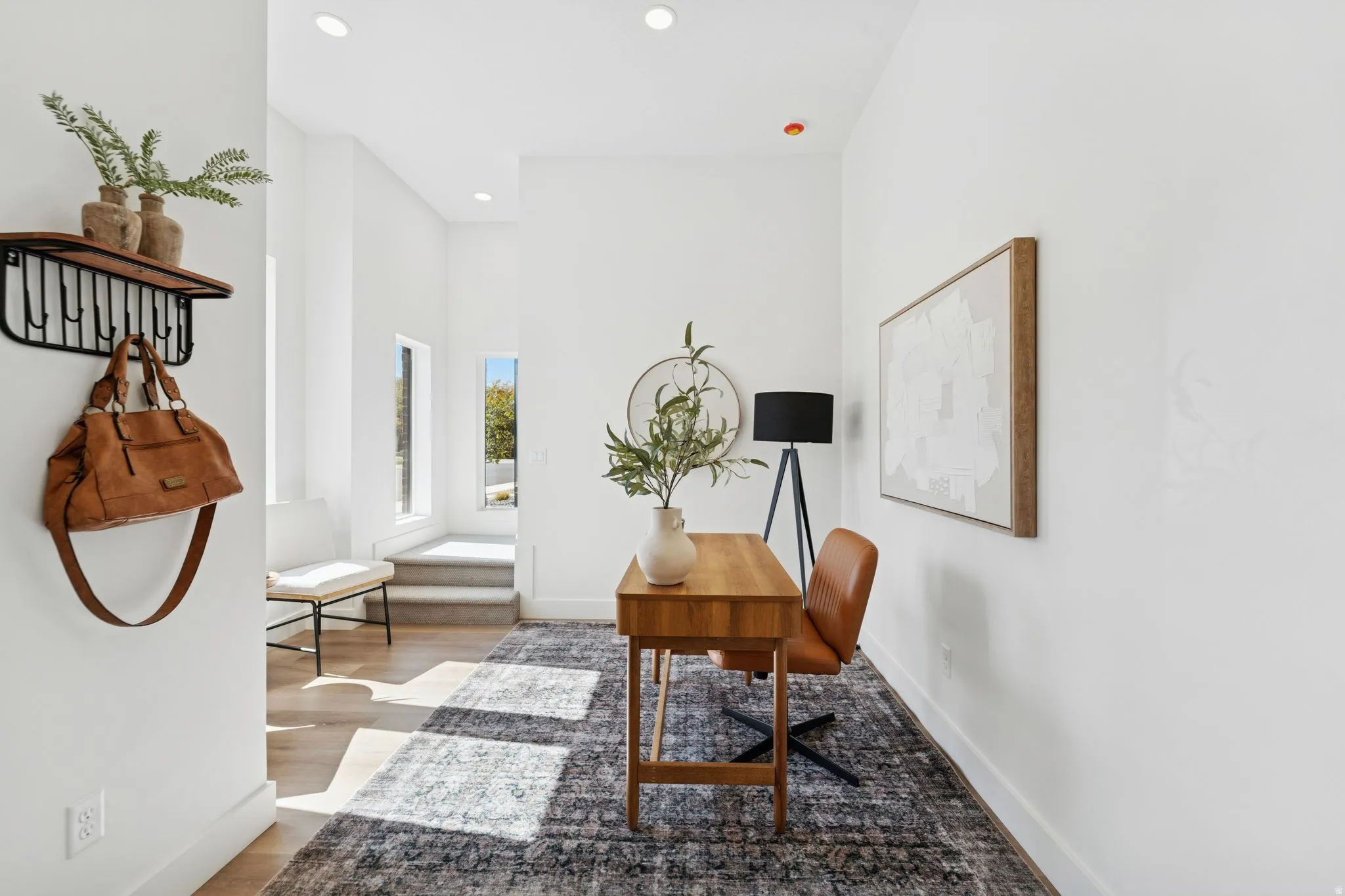 Office featuring light wood-style floors and recessed lighting