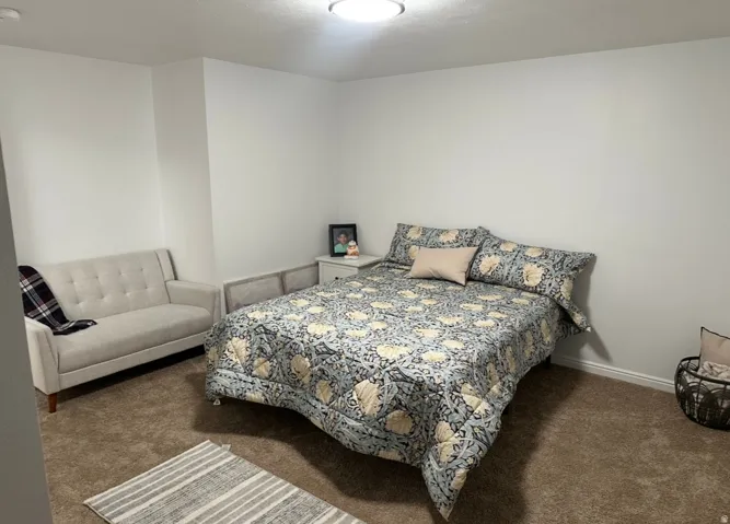Bedroom with dark carpet