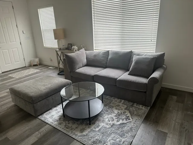 Living area with wood finished floors and baseboards