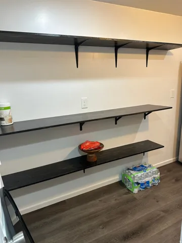 Detailed view of baseboards and wood finished floors