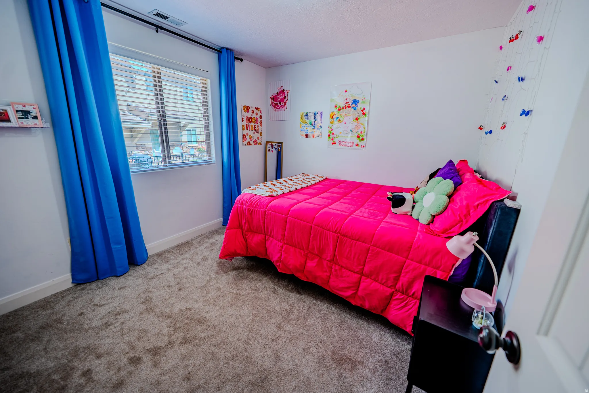 Bedroom with carpet flooring and baseboards