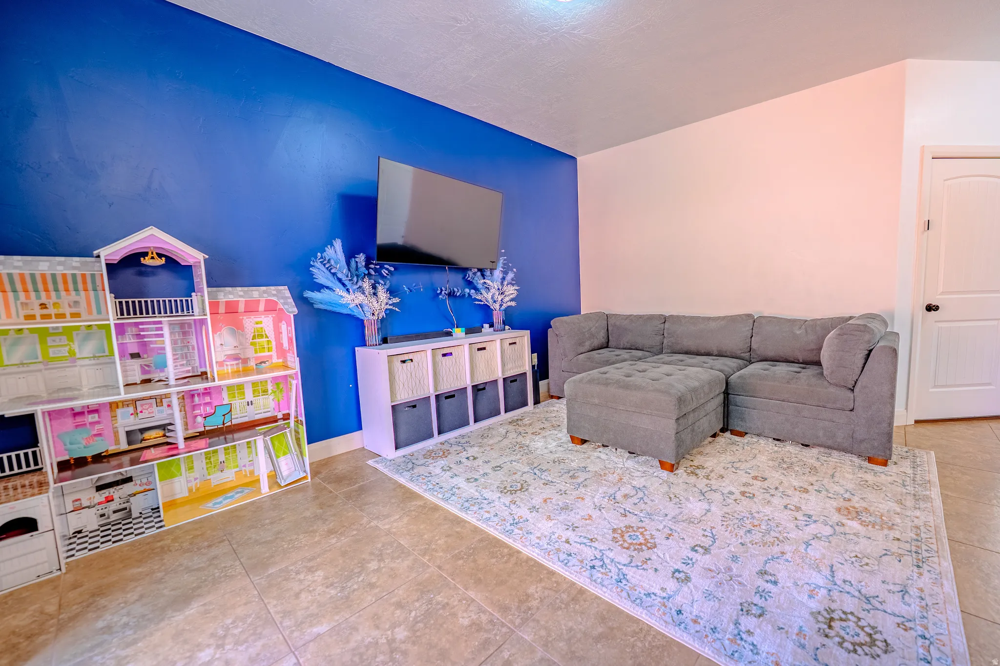 Living area featuring light tile patterned flooring