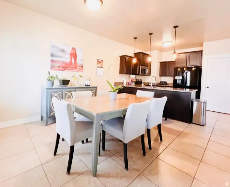 Dining room featuring light tile patterned floors