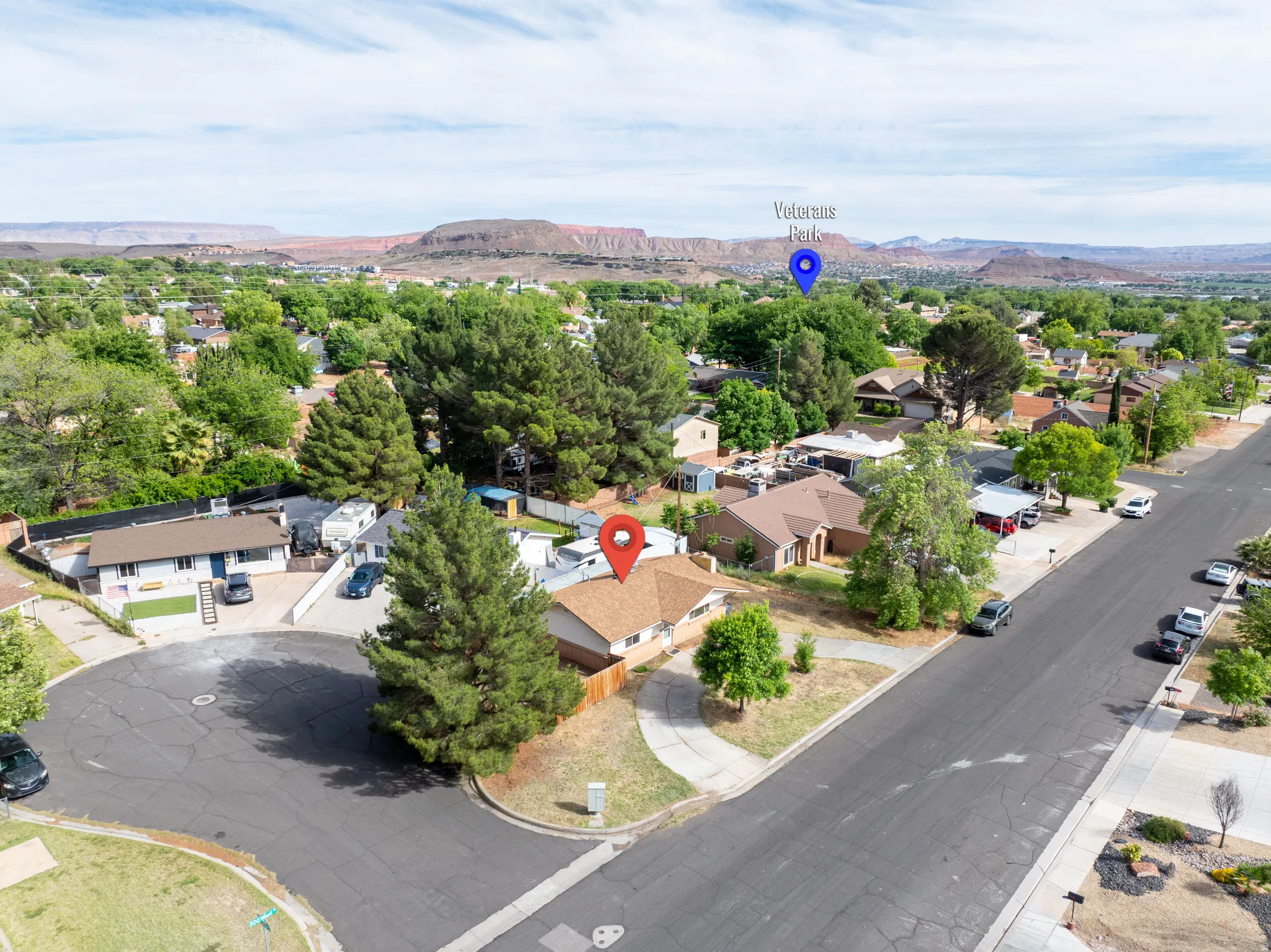 Aerial perspective of suburban area featuring a mountain backdrop