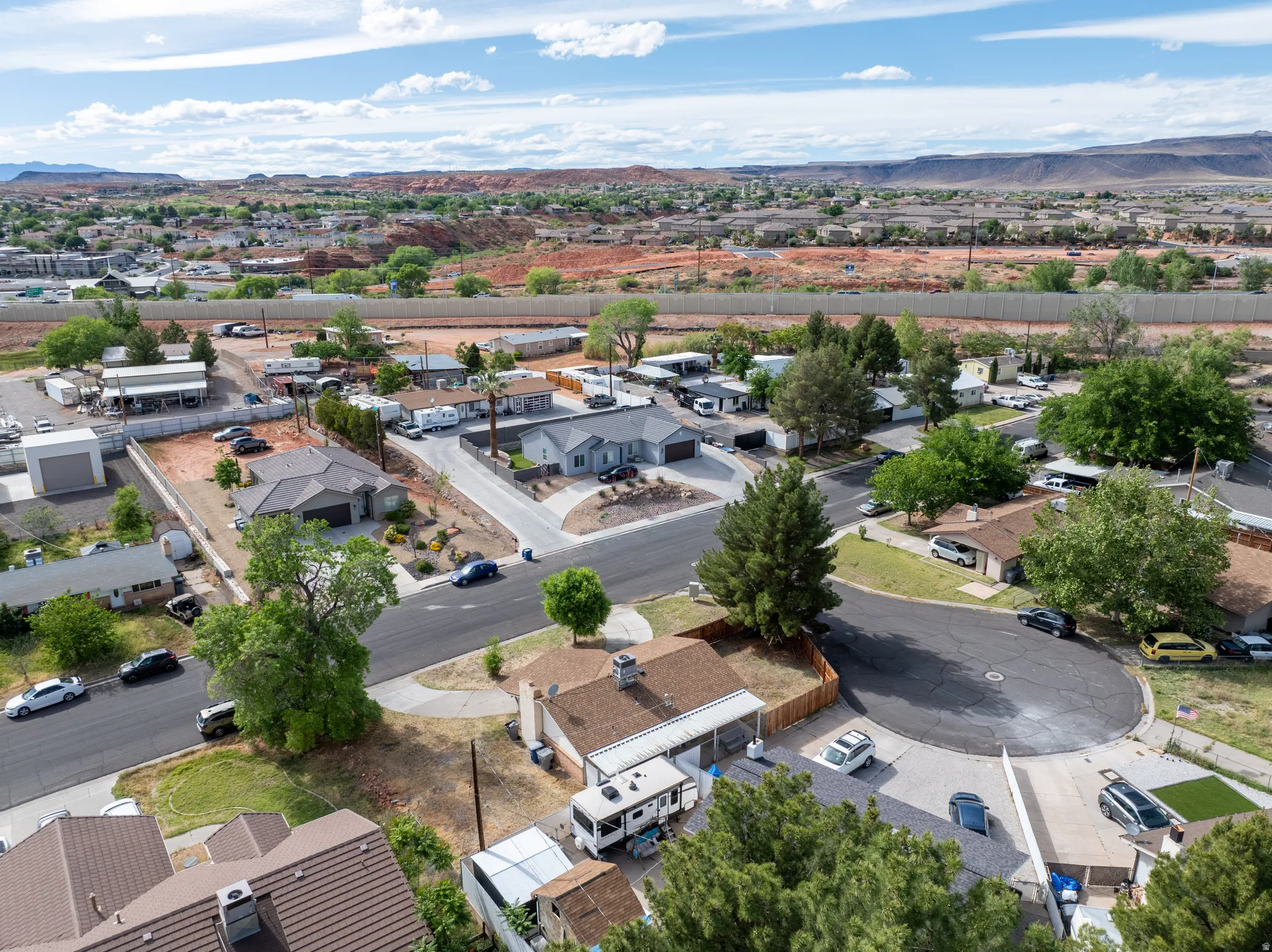Aerial view of residential area featuring a mountainous background