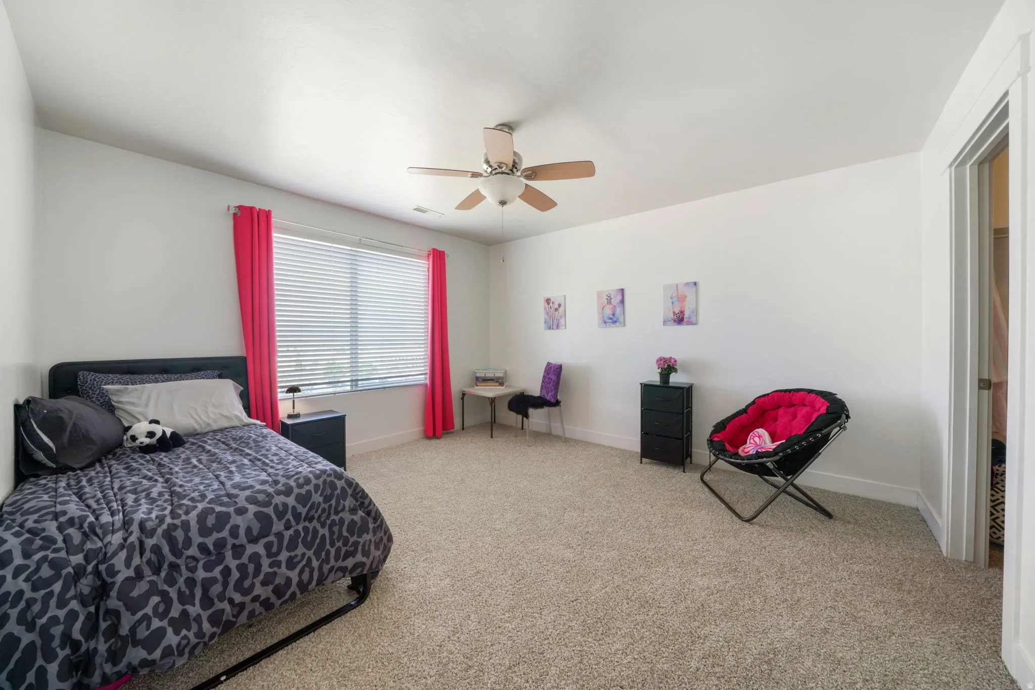 Bedroom featuring light carpet and ceiling fan