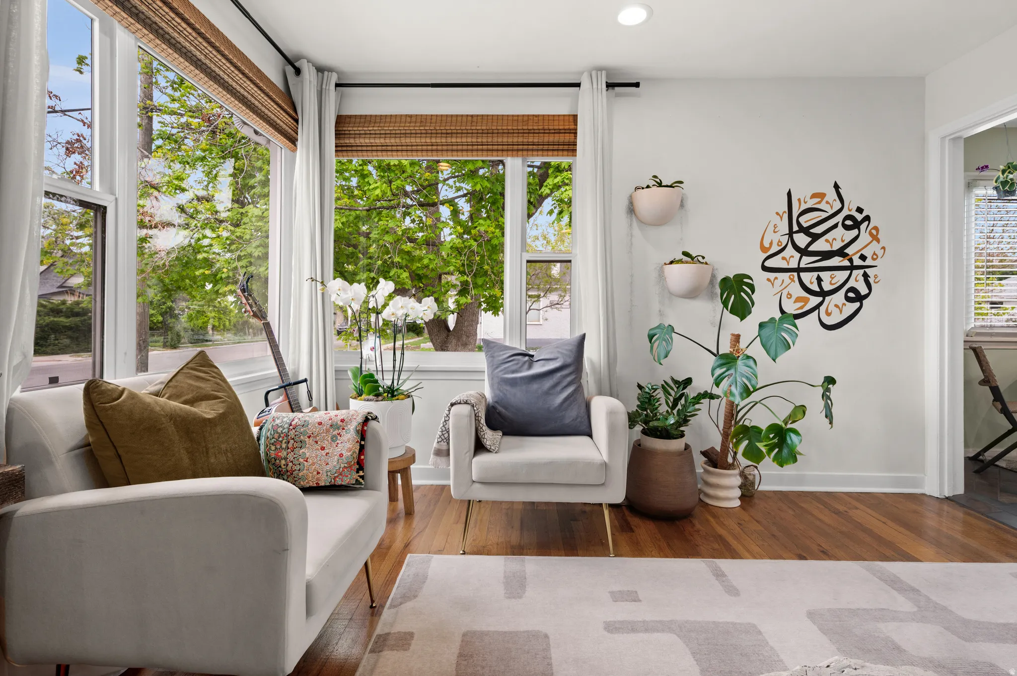 Living area with wood-type flooring and recessed lighting