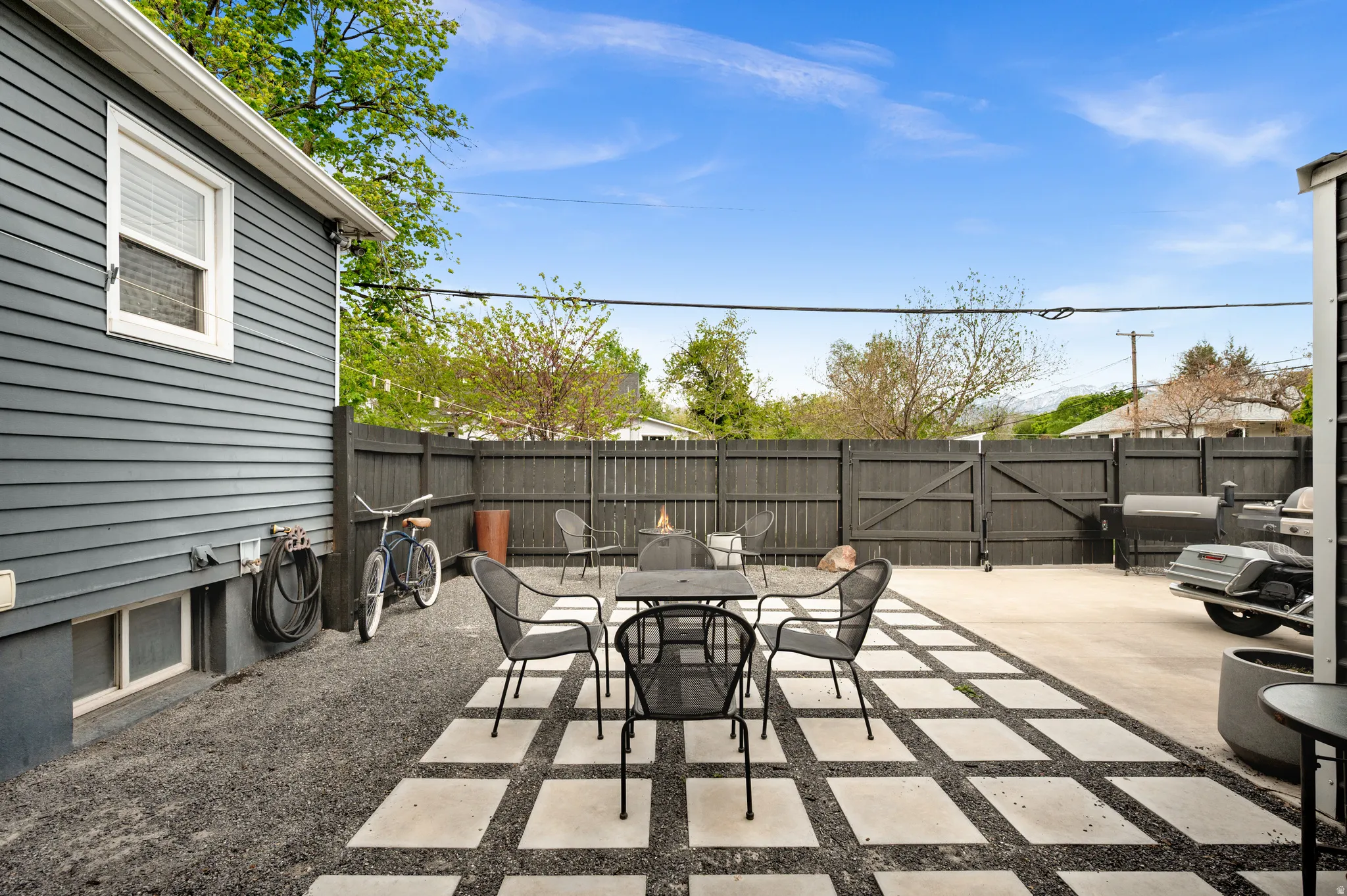 Fenced backyard with a patio and outdoor dining area