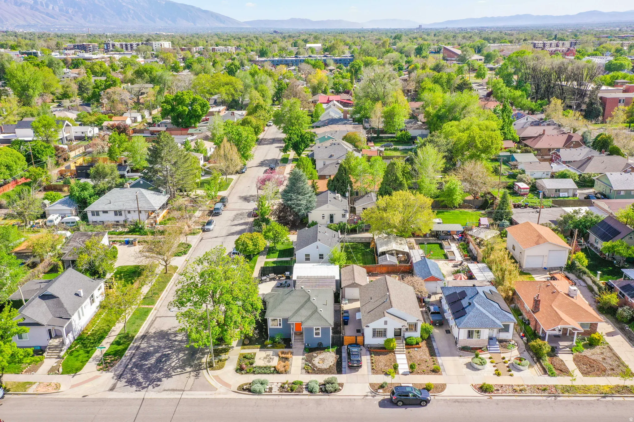Aerial view of residential area featuring a mountainous background
