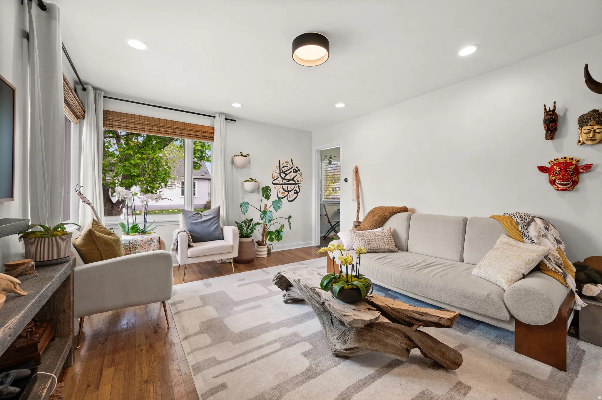 Living room featuring hardwood / wood-style floors and recessed lighting