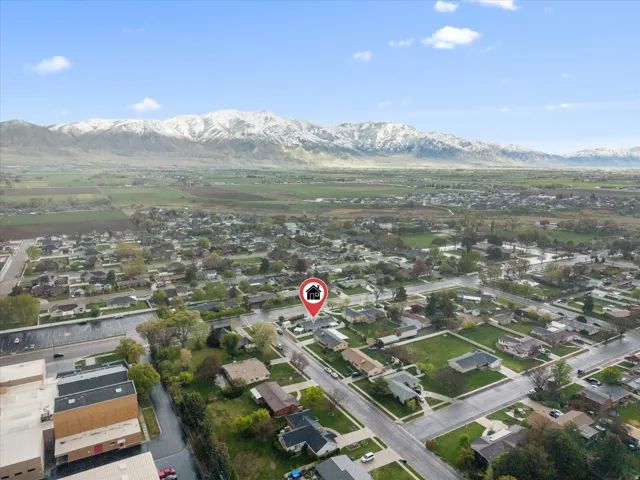 Aerial view of residential area featuring a mountainous background